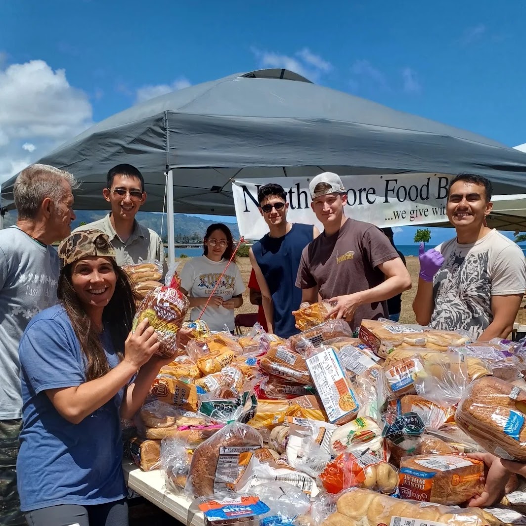 Community food giveaway with volunteers distributing fresh groceries